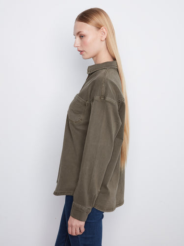 A convenient chest pocket adds functionality to this stylish button-front shirt. By Charlie B.