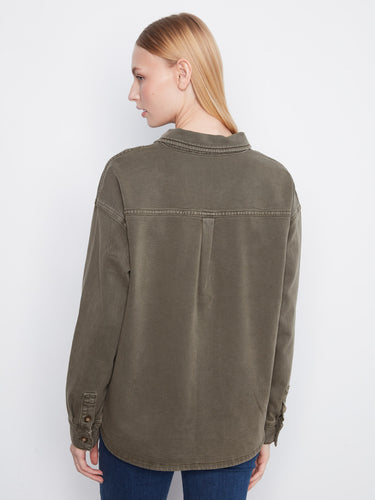 The button-front closure offers versatility and ease of wear in this chic shirt design. By Charlie B.