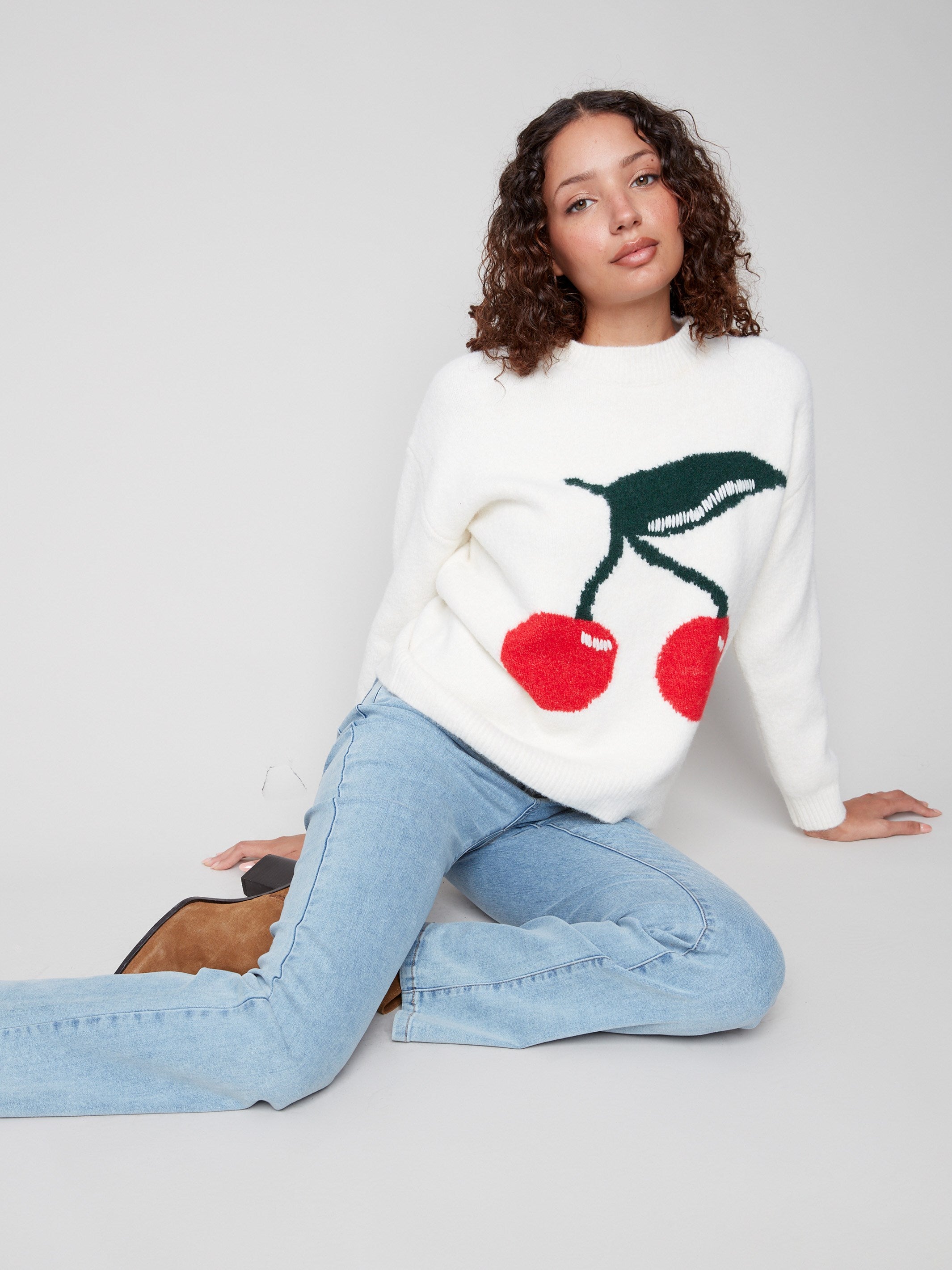 Intarsia sweater in white with lively cherry design, showcasing a plush feel by Charlie B.