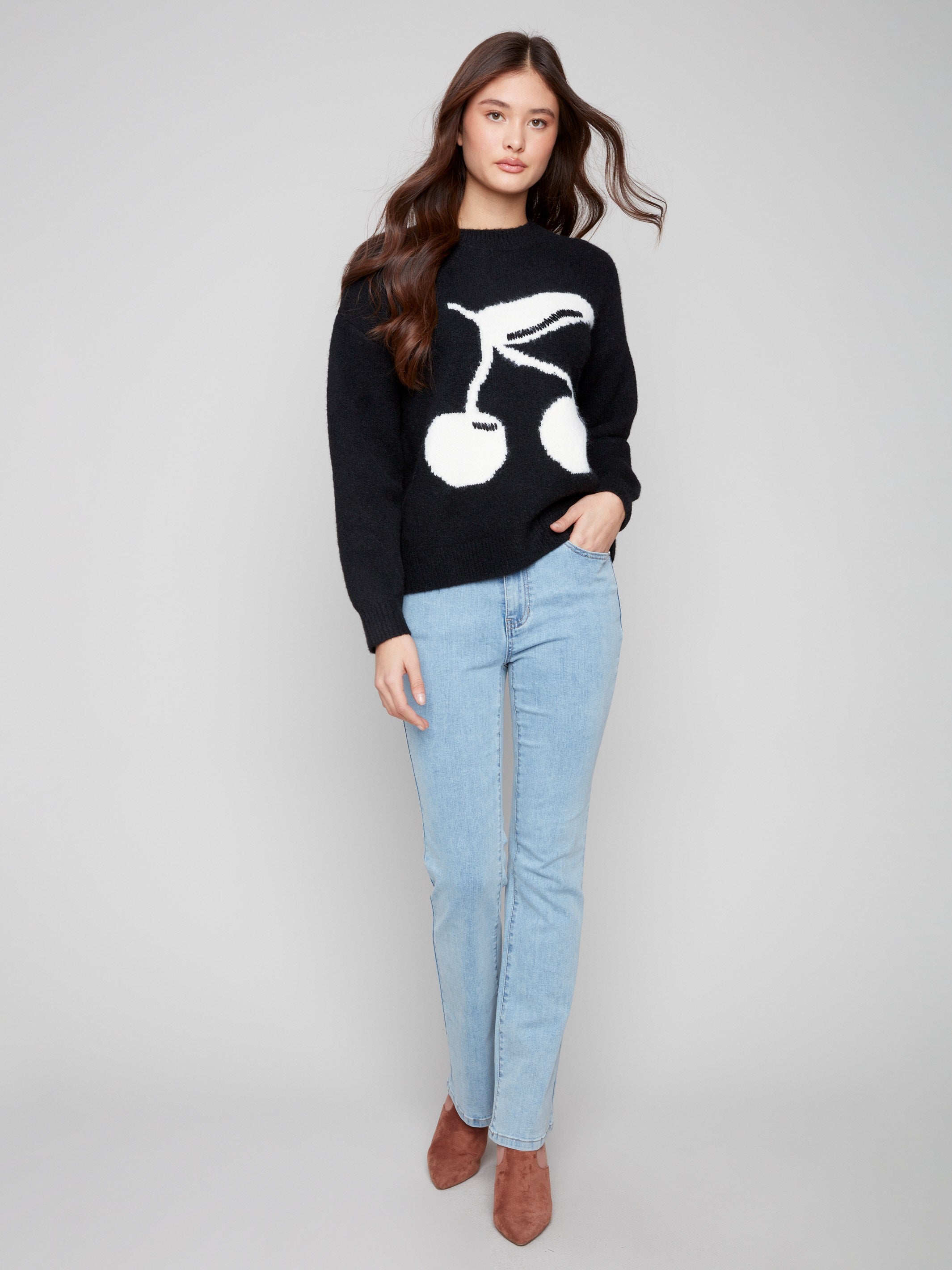 Stylish sweater featuring plush texture and delightful cherry pattern, ideal for any casual outing by Charlie B.