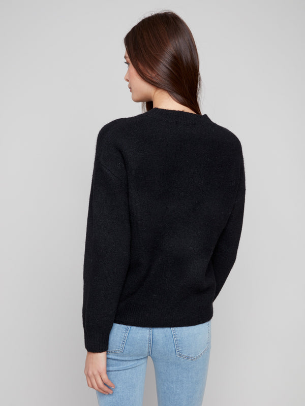Elegant drop shoulders enhance the relaxed fit of this black cherry intarsia sweater by Charlie B.
