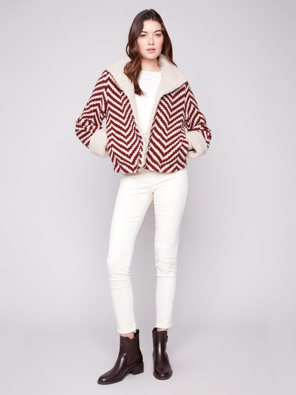 Stylish Chevron Boucle Jacket with faux sherpa trim and convenient side pockets for a chic look by Charlie B.