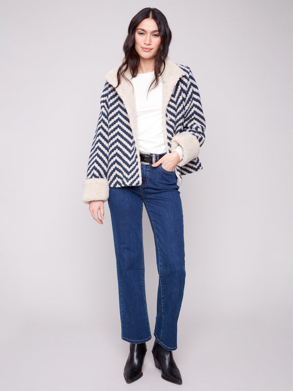 Navy Chevron Boucle Jacket with button closure, adding a sophisticated touch to any outfit by Charlie B.