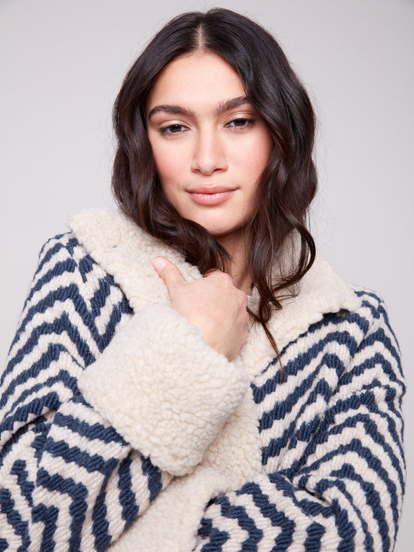 Navy Chevron Boucle Jacket designed with convenient side pockets for practicality and style by Charlie B.