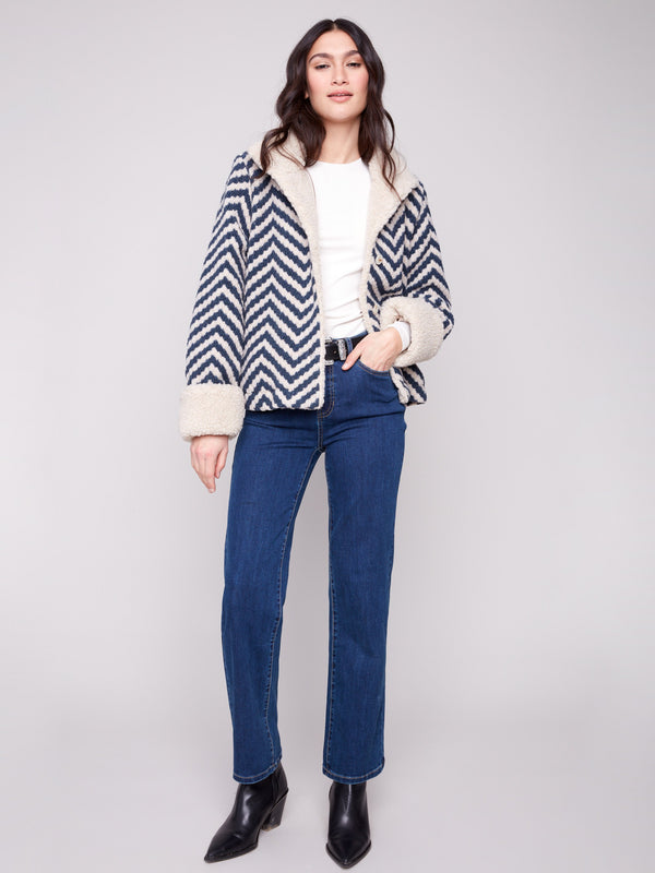Chic Navy Chevron Boucle Jacket crafted with button closure for a tailored fit and elegance by Charlie B.