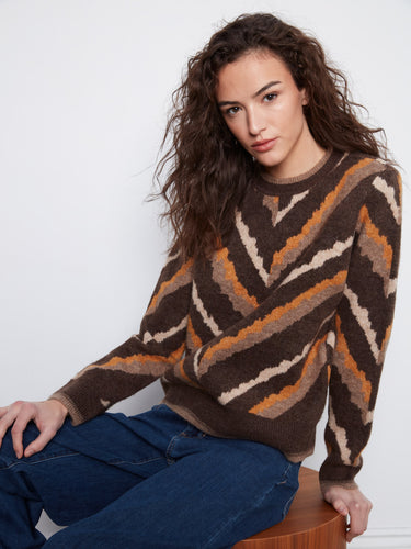 Stylish brown chevron sweater with ribbed cuffs, ideal for cool weather by Charlie B.