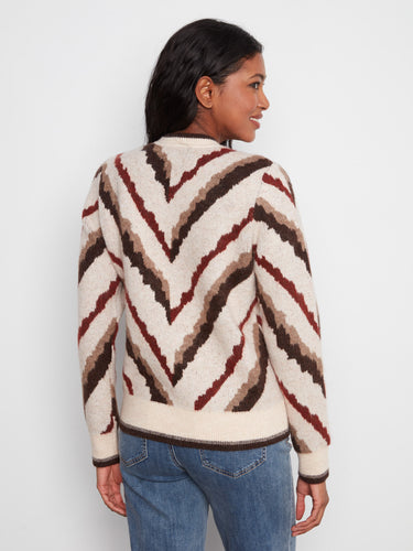 Chic sweater with bold chevron stripes, crafted to provide warmth and fashion-forward appeal for any occasion. By Charlie B.