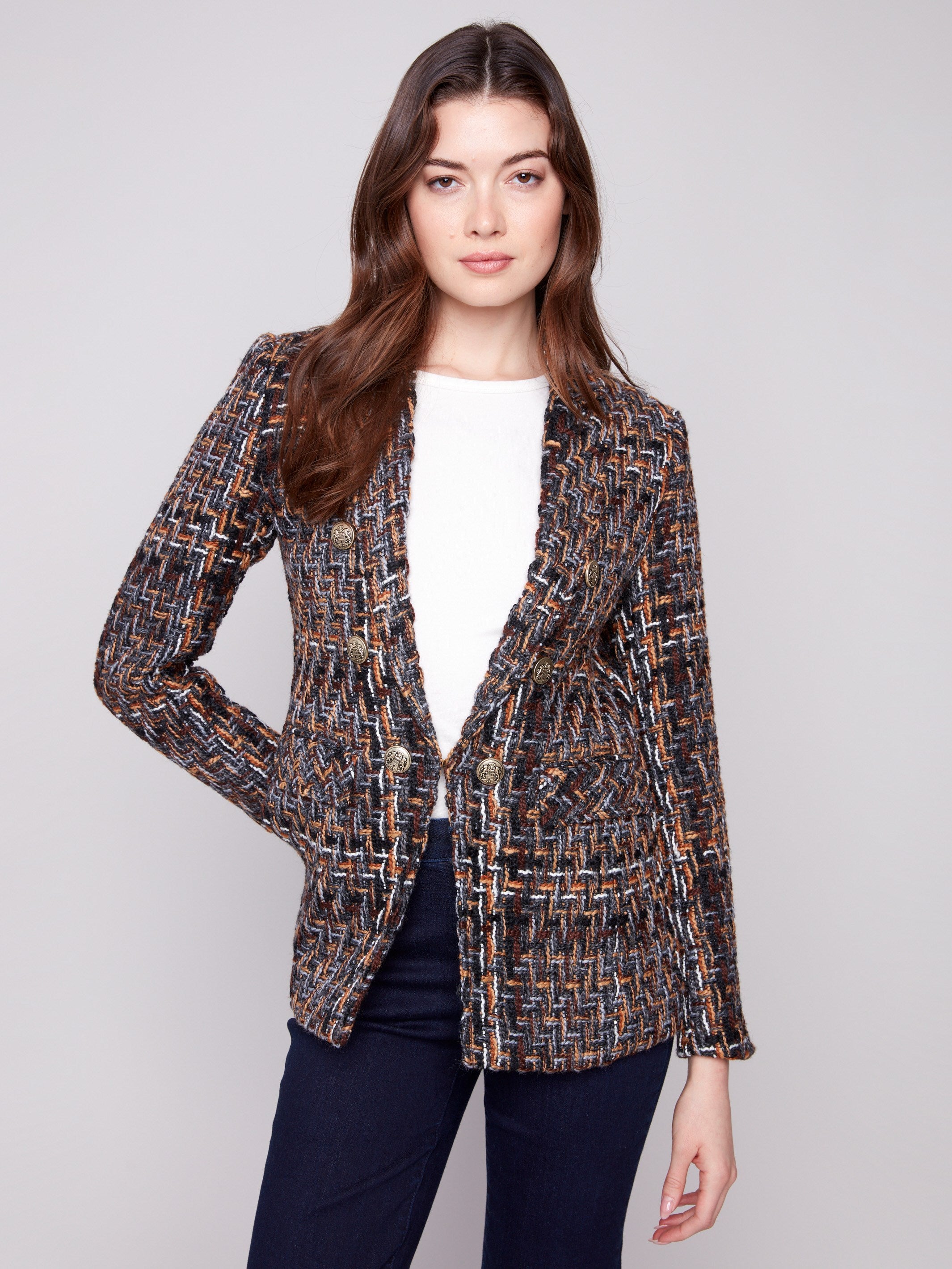 Stylish women's blazer showcasing intricate gold button details by Charlie B.