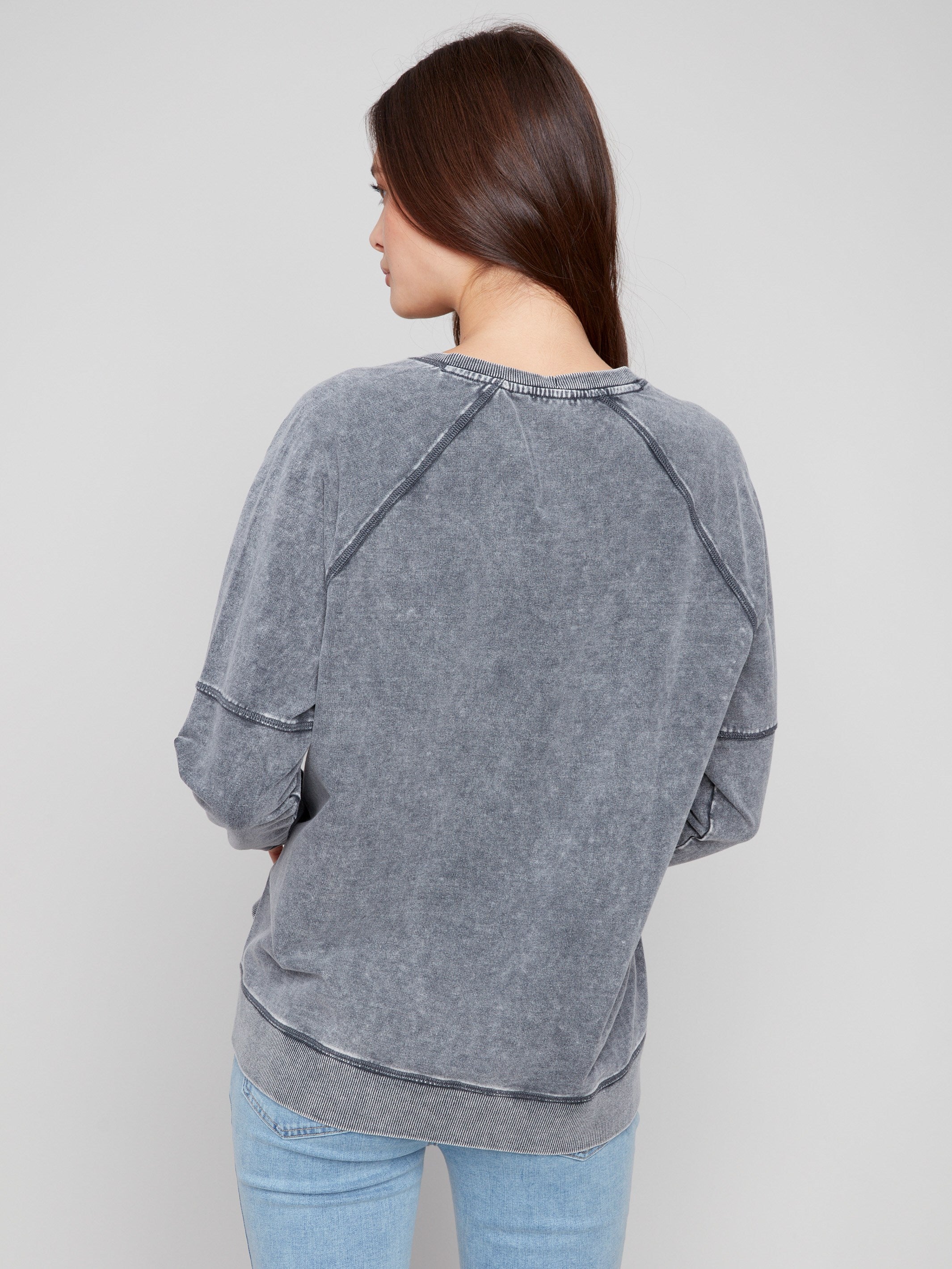 Comfortable V-neck top with side slits for added flexibility and style in any casual setting by Charlie B.