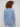 Slit hem detail enhances the casual vibe of this versatile denim V-neck top by Charlie B.