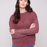 Cabernet sweater featuring a crew neck and intricate pointelle design, perfect for a cozy look by Charlie B.