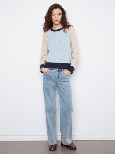 The speckled knit pattern adds a touch of texture and style to this versatile sweater, making it a wardrobe staple by Charlie B.