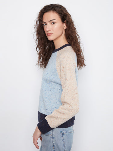 The blend of colors in the speckled knit creates an eye-catching look, making it both fashionable and unique by Charlie B.