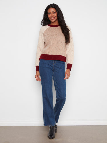 Earthy-toned sweater showcasing a speckled knit pattern, complete with contrast trim and crew neck by Charlie B.