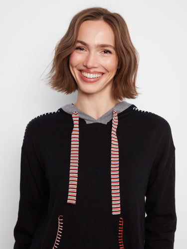 Cotton black hoodie showcasing a kangaroo pocket and striped drawstrings for added contrast by Charlie B.