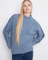 Blue sweater with a mock neck featuring long raglan sleeves, adding a cozy touch to your wardrobe by Charlie B.