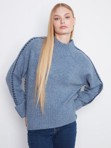 Blue sweater with a mock neck featuring long raglan sleeves, adding a cozy touch to your wardrobe by Charlie B.