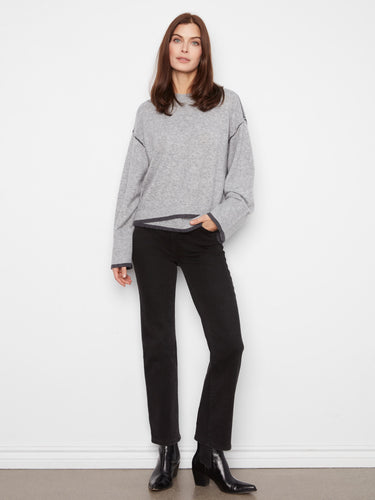 Stylish gray sweater with asymmetrical hem and drop shoulders, offering a relaxed fit by Charlie B.
