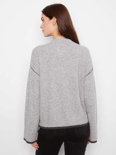 Fashionable gray sweater with drop shoulders, enhancing comfort and style effortlessly by Charlie B.