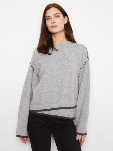 Chic gray sweater designed with an asymmetrical hemline, adding modern elegance to your look by Charlie B.