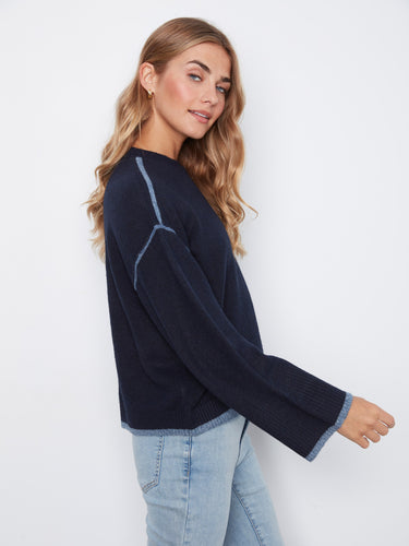 Contrast trim highlights the design, providing a subtle yet stylish detail to this cozy sweater ensemble by Charlie B.