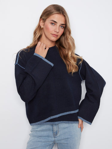 Wide sleeves enhance the cozy appeal of this versatile sweater, making it an essential piece for any wardrobe by Charlie B.