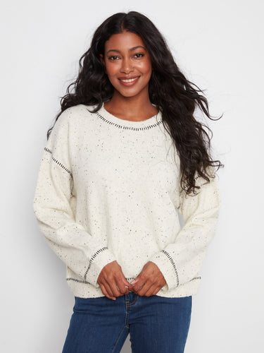 Sweater with a cozy crew neckline and speckled knit design, offering a charming look by Charlie B.