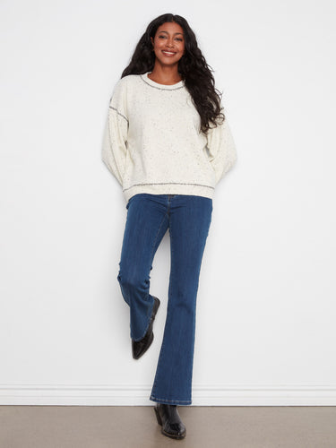 Long sleeves and whipstitch details add a touch of elegance to this versatile sweater by Charlie B.