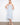 Light blue floral pattern dress with removable straps for a personalized look, offering elegant versatility by Charlie B.
