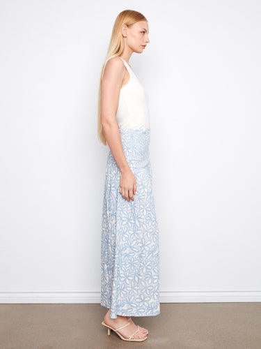 Chic light blue floral attire with midi length that can transform from skirt to dress effortlessly by Charlie B.