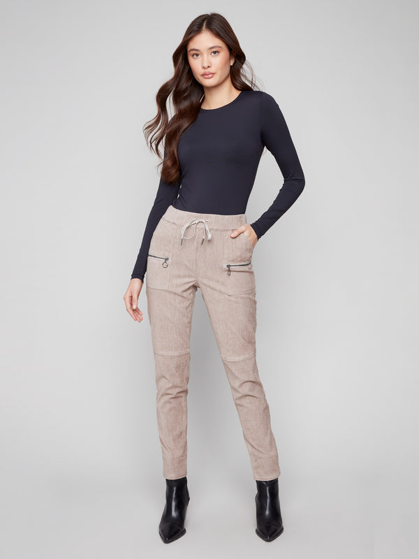 Almond corduroy jogger pants featuring a slim fit and elastic waistband for a comfortable style by Charlie B.