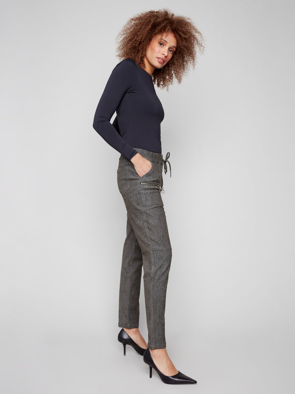 Mid-rise corduroy joggers with two front zipper pockets for added functionality by Charlie B.