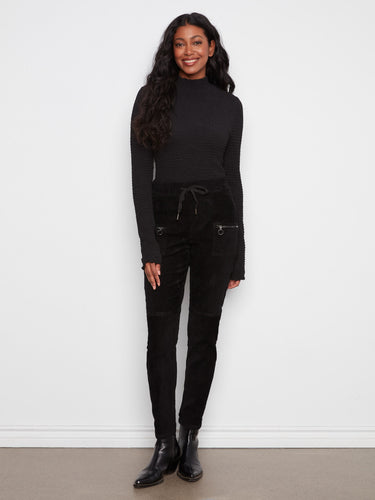 These pants feature a slim fit design, perfect for a sleek and modern look. Crafted with care by Charlie B.