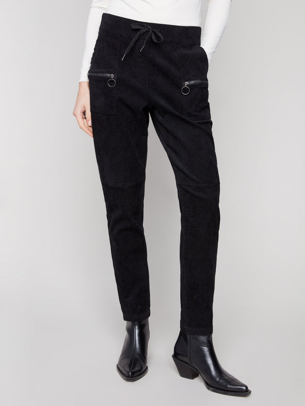 Black jogger pants in stretchy corduroy fabric featuring drawstrings and mid-rise waist, offering a sleek look by Charlie B.