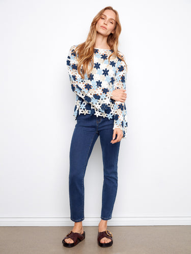 Elegant floral crochet top with 3/4 sleeves, providing a chic and comfortable style suitable for everyday wear. By Charlie B.
