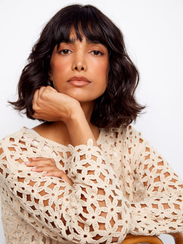 Enjoy the effortless elegance of drop shoulders in this stunningly designed crochet piece that adds flair to any casual look instantly. By Charlie B.