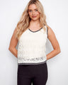 Elegant crochet design top with a stylish V-neckline, perfect for summer outings. By Charlie B.
