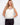 Elegant crochet design top with a stylish V-neckline, perfect for summer outings. By Charlie B.