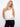 Trendy sleeveless design with unique crochet detailing, adding elegance to your wardrobe. By Charlie B.