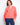 Coral blouse featuring a stand neckline with intricate embroidery on the sleeves, adding a touch of elegance. By Charlie B.