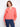 Coral blouse featuring a stand neckline with intricate embroidery on the sleeves, adding a touch of elegance. By Charlie B.