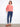 Chic coral blouse with button-front closure and delicate sleeve embroidery for a stylish look. By Charlie B.