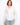 White shirt with a classic button-front closure, designed in 100% cotton for comfort and style by Charlie B.