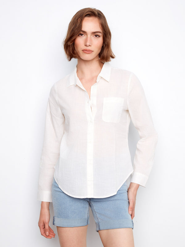 White shirt with a classic button-front closure, designed in 100% cotton for comfort and style by Charlie B.