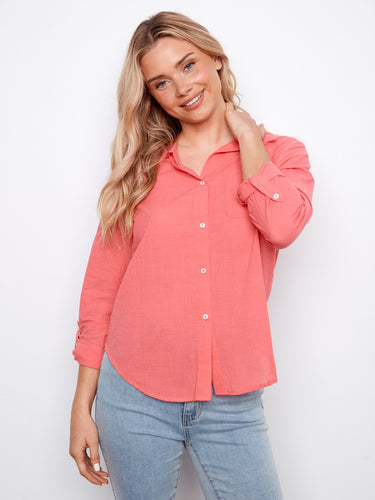 The design includes a convenient chest pocket, perfect for small essentials. Crafted in breathable cotton by Charlie B.