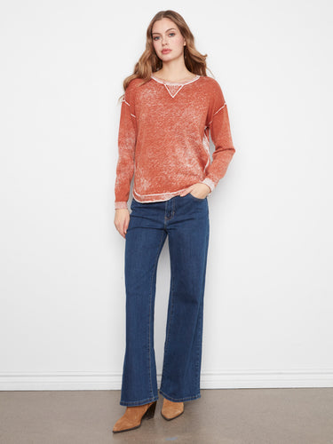 Showcasing a rounded hem, this sweater brings a modern touch to classic design. Made with care from 100% cotton by Charlie B.