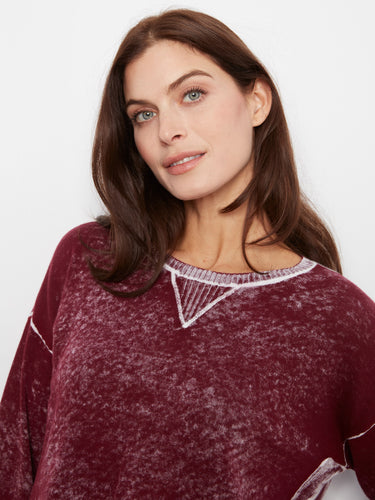 This sweater showcases drop shoulders for a relaxed fit, made from soft 100% cotton with a washed finish by Charlie B.