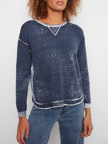 This sweater features drop shoulders and ribbed cuffs, adding a touch of relaxed elegance to the design by Charlie B.