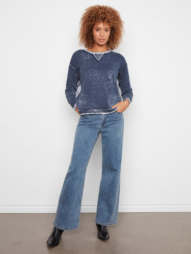 Enjoy the comfort of 100% cotton in this stylish sweater with its unique reverse print design by Charlie B.