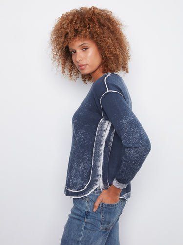 The rounded hem adds a modern flair to this midnight blue crew neck sweater, perfect for any casual outing by Charlie B.